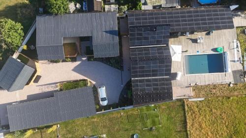 an overhead view of a building with solar panels at DACSE-VILLAGE - Gite 01 in Dax