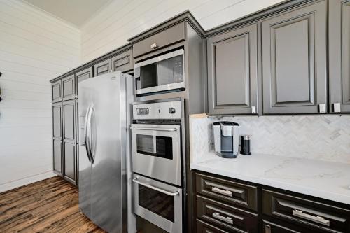 a kitchen with a stainless steel refrigerator and cabinets at Paradise Cove in Granite Shoals