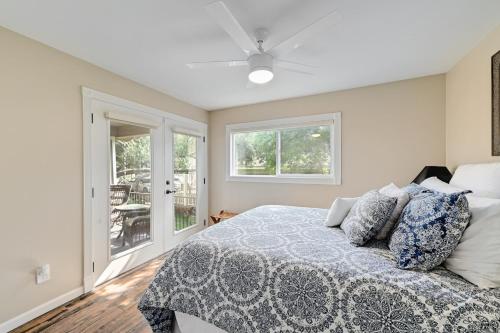 a bedroom with a bed with a blue and white blanket at Paradise Cove in Granite Shoals