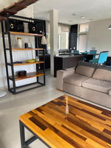 a living room with a couch and a table at Casa Cabalango in Cavalango