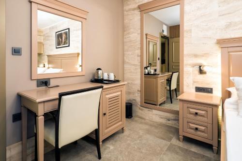 a bathroom with a sink and a mirror at Central Pazar Rooms in Split