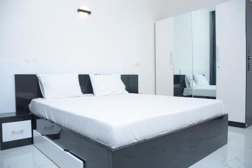 Llit o llits en una habitació de Cosy House