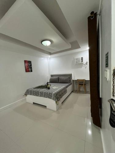 Ένα ή περισσότερα κρεβάτια σε δωμάτιο στο Carandang Tourist Inn