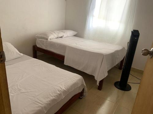 Postel nebo postele na pokoji v ubytování casa xiomy