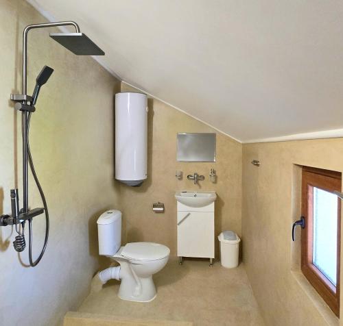 a bathroom with a toilet and a sink at Guest House - Heaven in Byala