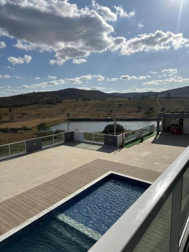 a swimming pool on the roof of a house at Condominio HOME DUPLEX SERRA NEGRA in Bezerros