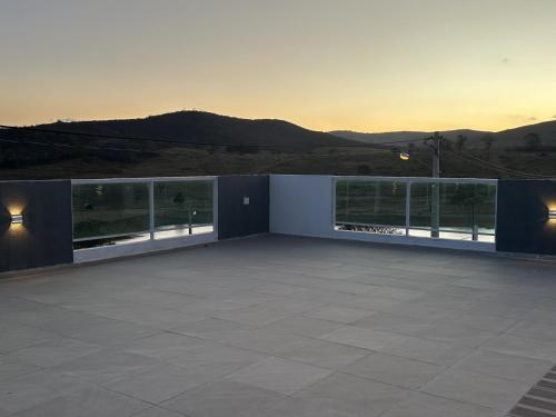 a balcony with a view of the mountains at Condominio HOME DUPLEX SERRA NEGRA in Bezerros