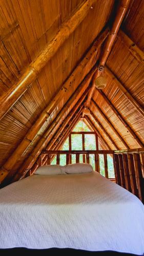 Tiny Houses Unique Tayrona - Dentro del Parque Tayronaにあるベッド