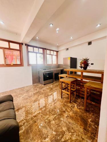a living room with a couch and a table at Casa Don 20 in San Marcos La Laguna