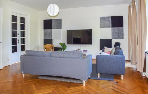 a living room with a couch and two chairs at Beautiful Home In Flyinge in Flyinge