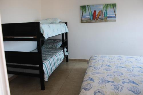 Postel nebo postele na pokoji v ubytování Rento apto en Playa Blanca Ph Founders