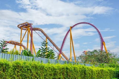 a roller coaster at a theme park at Guangzhou He She Art Apartment in Guangzhou