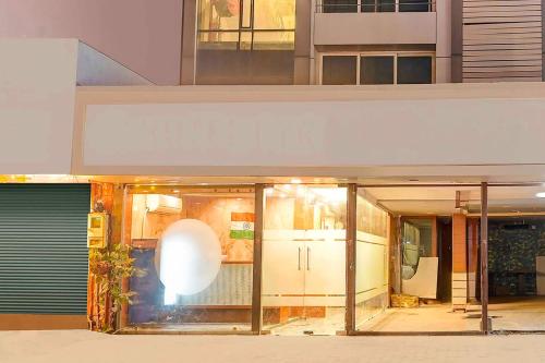 a view of a building with glass doors at Hotel O Airport Road in Ahmedabad