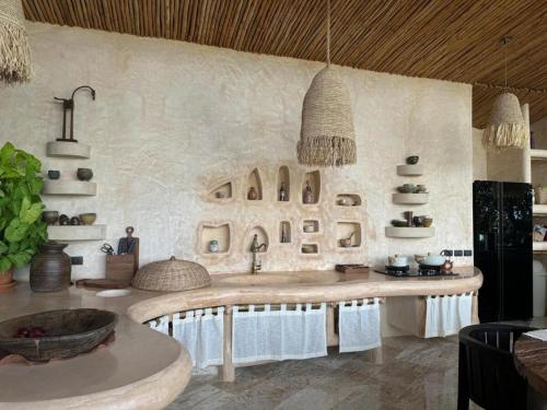 a kitchen with a large counter with a sink at V222 Zen Sea View Villa Pool, Hot Tub & Chess in Plai Laem