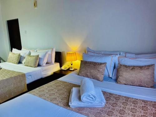 Postel nebo postele na pokoji v ubytování Muduna Walawwa Resort