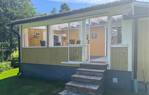 a house with glass doors and stairs on it at 3 Bedroom Cozy Home In Nässjö in Nässjö