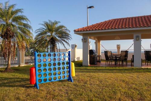 a giant board game in a yard in front of a house at Villa Las Tres Gaviotas I in Salinas