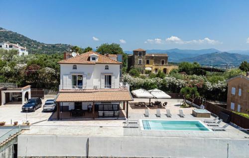 a villa with a swimming pool and a house at 5 Bedroom Awesome Home In Casalvelino in Casal Velino