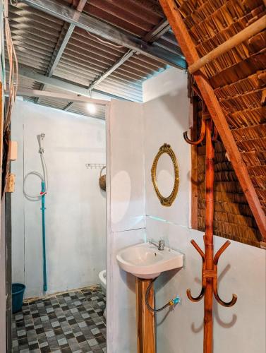 a bathroom with a sink and a shower at Yellow Sun Kampot in Kampot