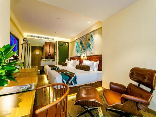 a hotel room with a bed and a desk at James Joyce Coffetel· Xianyang Renmin Road Central Square Store in Xianyang