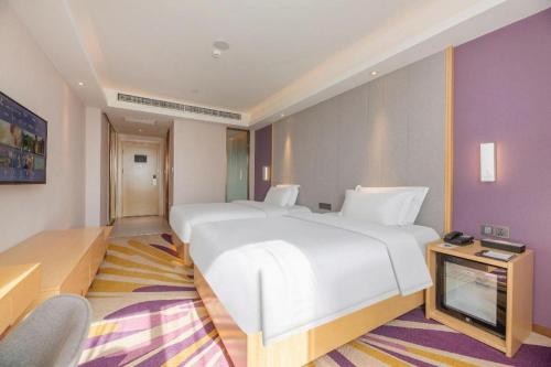 Letto o letti in una camera di Lavande Hotels Jinzhong Youjian Pingyao