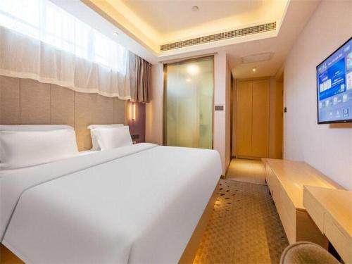 Letto o letti in una camera di Lavande Hotels Jinzhong Youjian Pingyao
