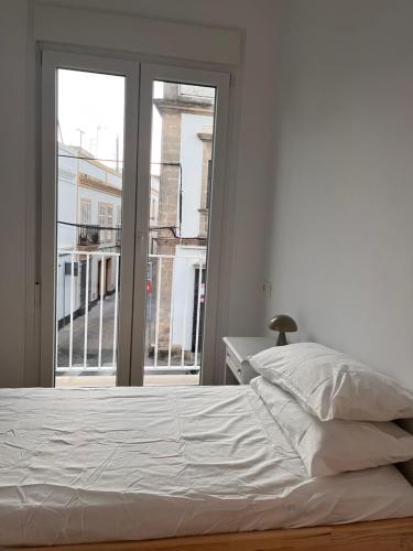 Postel nebo postele na pokoji v ubytování Casa El Puerto