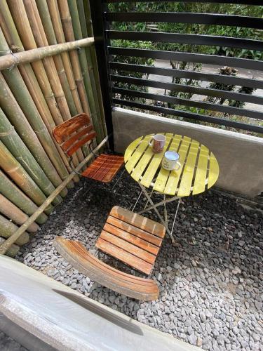 a table and two chairs and a table and a bench at Casa Domingo Guest House in Camalig
