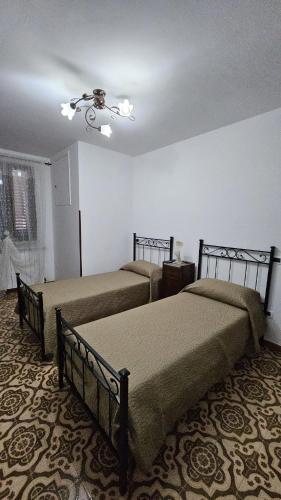 Ένα ή περισσότερα κρεβάτια σε δωμάτιο στο Casa vacanze La Commare