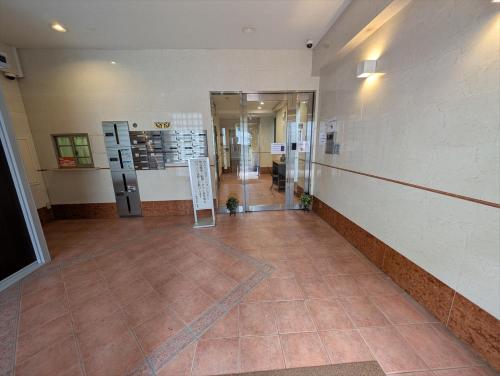 an empty hallway of a building with a lobby at MerisuKabukicho,Tokyo in Tokyo