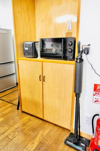 Kuchyň nebo kuchyňský kout v ubytování Kawagoe Inn Tokine 時の鐘まで徒歩3分 敷地内駐車場 お子様用プレイルーム