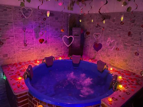 a jacuzzi tub with lights in a room at Modern, Luxurious and Tradicional Apartments by Samilis Place in Cali