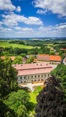 an overhead view of a large building with trees at Zámek Načeradec in Načeradec
