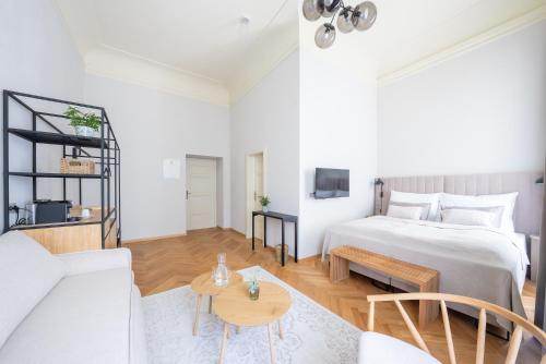 a bedroom with a bed and a living room at Zámek Načeradec in Načeradec