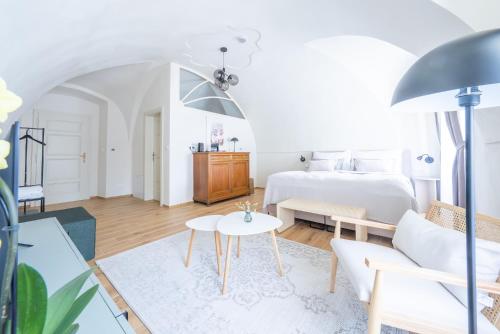 a bedroom with a bed and a table at Zámek Načeradec in Načeradec