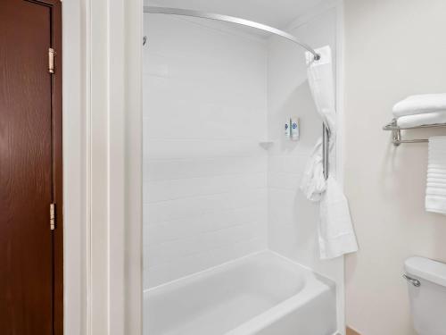 a white bathroom with a shower and a toilet at Comfort Inn & Suites O'Fallon - St Louis Area in O'Fallon