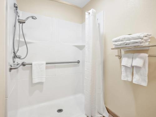 a bathroom with a shower with a shower curtain at Comfort Inn & Suites O'Fallon - St Louis Area in O'Fallon