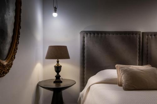 BB 22 Charming Rooms & Apartmentsにあるベッド