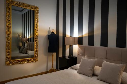 BB 22 Charming Rooms & Apartmentsにあるベッド