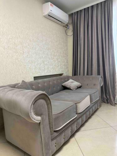 a large bed in a living room with a projector at Театральна Дванадцять in Pervomaysʼk