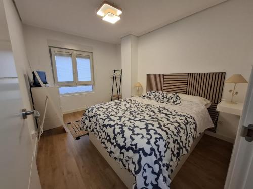 A bed or beds in a room at Surf Playa 1 línea