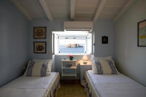 Ένα ή περισσότερα κρεβάτια σε δωμάτιο στο Villa Ostria