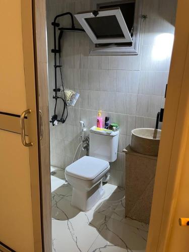 a bathroom with a toilet and a sink at Eshyan Guest House in Aswan