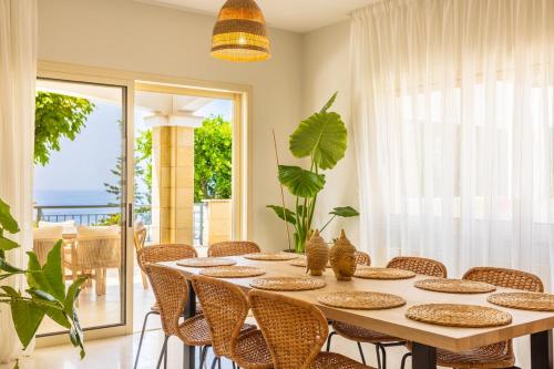 a dining room with a table and chairs at Luxury Seaview Limassol Villa Pool Jacuzzi Sauna in Limassol