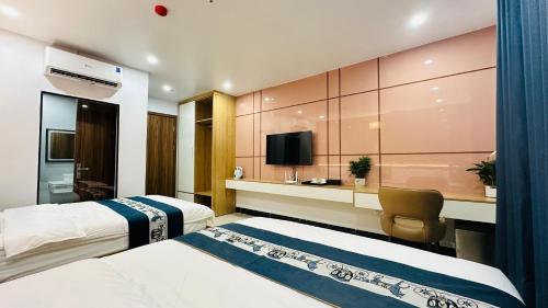 Postel nebo postele na pokoji v ubytování Hestia Hotel