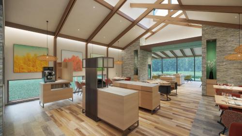 a living room with a kitchen and a dining room at Holiday Inn Resort Shinano-Omachi Kuroyon by IHG in Omachi