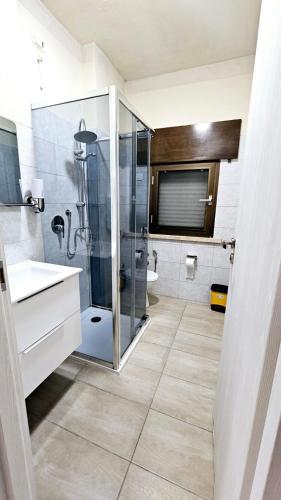 a bathroom with a shower and a sink and a toilet at appartamento di venezia in Venice