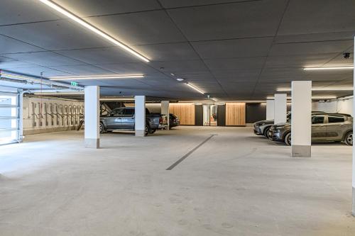 a parking garage with cars parked in it at Hotel Alpenhof in Grossarl