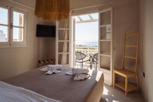 Postel nebo postele na pokoji v ubytování Paradise Hotel