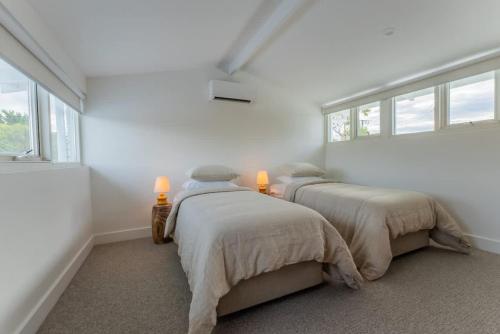 Ένα ή περισσότερα κρεβάτια σε δωμάτιο στο Hygge House - 300m to the beach